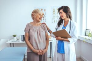 Portrait,Of,Female,Doctor,Explaining,Diagnosis,To,Her,Patient.,Female